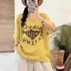 Camiseta de Linho Tingido em Fio com Estampa, Manga Curta, Gola Redonda, Corte Solto, Emagrecimento, Versátil, Estilo Casual e Relaxado - Nova Peça de Verão