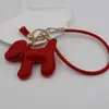 Funda para teléfono con borla de cachorro linda creativa, correa para llavero de coche, accesorio para bolso, universal para teléfonos móviles