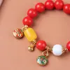 Pulsera de Raíz de Bodhi de Jade Rojo Especificaciones 1.2 con Colgante de Campana de Oro Arena Pulsera de Rosario para Hombres y Mujeres Venta al por Mayor