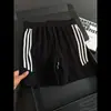 Pantalones deportivos de verano transpirables y frescos con rayas de escamas de dragón estilo americano para comercio exterior, shorts casuales para correr al aire libre para hombres