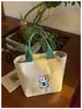 Bolsa de lona retro de tonos cálidos con acabado suave, para estudiantes universitarias y trabajadoras de oficina, adecuada para ir a clase por la mañana y para viajar.