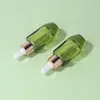 Venda Direta de Fábrica Frasco de Essência 20ml Frasco Transparente Verde para Óleo Essencial Frasco de Vidro para Água de Essência Conta-gotas Óleo de Limpeza em Estoque