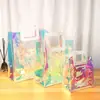 Bolsa de Mão Transparente PVC a Laser Cor Roupas Sacola de Compras Plástico Maquiagem Bolsa Mágica de Presente de Celebridade da Internet