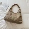 El bolso tote único, simple, moderno y a la moda de Shuai Mi Jia para principios de otoño de 2026 es un bolso casual, de nicho y de gran capacidad para mujer