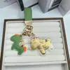 Nuevo Colgante de Pony de Dibujos Animados en Imitación Oro, Pinza para Teléfono en Forma de Cuchara, Colgante para Bolso, Estilo Minimalista Moderno Personalizado
