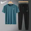 Conjunto Esportivo de Seda de Gelo Masculino Casual de Verão Camiseta de Manga Curta Fina e Calça Longa Conjunto Completo para Corrida Secagem Rápida Conjunto de Duas Peças para Homens