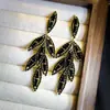 Nuevos Pendientes Versátiles de Estilo Oscuro con un Temperamento de Pluma de Moda de Alta Gama, Pendientes Coreanos de Hoja Completos de Diamante Luz de Lujo