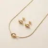 Set de Collar y Pendientes de Acero Inoxidable de Larga Duración, Nueva Moda Europea y Americana Joyería con Colgante de Nudo de Amor para Mujeres