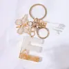 Llavero Colgante de Borla con Letra Inglesa Personalizada de Purpurina Blanca con Resina Epoxi y Colgante de Resina con Pan de Oro, Llavero Sencillo