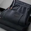 Pantalones deportivos para hombre al por mayor transfronterizos, nuevo modelo primavera y otoño 2026, corte recto, ajuste holgado, gris, pantalones casuales de negocios de alta gama para hombre
