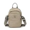 Bolsa Transversal Cor Sólida Simples Estilo Novo Verão 2026, Estilo Minimalista, Bolsa de Nylon Leve e Durável, Bolsa Versátil para Celular de Viagem