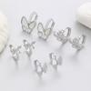 Diseño simple de moda, aretes de lujo con hebilla para la oreja con lazo de alto sentido, viento frío de fritilaria, aretes europeos y americanos al por mayor