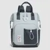 Bolsa de mamá de nuevo estilo, mochila de viaje de doble hombro a la moda con múltiples bolsillos y correas de hombro acolchadas con aire en bloques de color