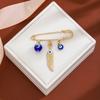 Broche de borla de ojo de diablo con incrustaciones de diamantes, estilo creativo europeo y americano, con sentido avanzado, ojos azules, suéter de cintura ajustada, broche de viento frío