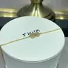 Aretes de oro de 18 quilates de Fred incrustados con diamantes con diseño de nudo doble y elegante collar con borla en forma de pera, un toque de lujo y moda