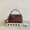 Bolso de mano francés de nicho texturizado elegante para mujer otoño comercio exterior simple retro mate casual bandolera cruzada