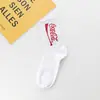 Nuevos calcetines altos de letras ins Cola estilo coreano personalizados medias hip hop marca de moda callejera europea y americana calcetines para parejas hombres y mujeres
