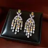 Pendientes de borla con flor de trébol de circonita vintage con un toque de alta gama, pendientes versátiles y de moda al por mayor