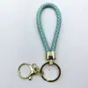 Venta al por mayor del fabricante Llavero de Cuerda de Aleación Tejida y Cuero Accesorios Colgantes Material PU Bolsas Pequeñas de Regalo Accesorios para Llaveros