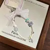 Correa de muñeca para teléfono móvil con diamantes brillantes, exquisita y de alta gama, accesorio súper elegante, estilo corto, adecuada para viajes al aire libre y previene la pérdida