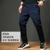 Calças Casuais Extra Grandes de Primavera e Outono Masculinas Largas Retas Plus Size Calças Masculinas Calças para Gordos Calças Masculinas Espessadas com Forro de Lã