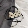Elegante bolso Xiaomi de lunares de nicho para mujer, nuevo de moda de verano 2026, bolso cruzado, bolso de mano pequeño exquisito, bolso croissant