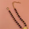 Pulsera de Trébol de Cuatro Hojas Galvanizado Moda Pulsera de Pareja Pulsera con Cuentas de Vidrio Negro Multifacético Colgante de Corazón