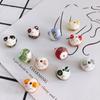 Accesorios de joyería DIY al por mayor cerámica dibujado a mano lindo gato de la suerte cuentas sueltas accesorios de material para pulsera con cuentas