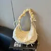 Bolso de hombro con lazo de tirante plisado de diseño de nicho transfronterizo modelo nuevo 2026 textura de alta calidad bolso de axila bolso tipo dumpling