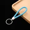 Llavero de cuerda de cuero colgante para coche accesorios cuerda de llave de cuerda de cuero tejido pu para empujar pequeño regalo fabricantes al por mayor