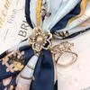 Versión coreana de moda de lujo ligero, hebilla fija de cinturón de abrigo de hada, gabardina, bufanda cuadrada, hebilla de bufanda, accesorios al por mayor