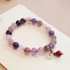 Pulsera elástica de cristal natural material de pozo antiguo temperamento coreano pulsera de cristal de fresa nueve fuegos púrpuras joyería al por mayor