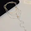 Nuevo collar de perlas multicapa en forma de Y con colgante de estrella de circón estilo europeo y americano, cadena de clavícula de diseño único, cadena para suéter para mujer