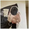 Comercio electrónico transfronterizo nuevo bolso pequeño elegante de lunares para mujer asa de lazo bolso con forma de luna para ir al trabajo bandolera de un solo hombro bolso moderno