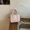 Bolsa Balde Simples de Grande Capacidade Portátil Estilo Novo Primavera 2026 para Mulheres, Bolsa de Ombro Casual Relaxada, Bolsa Transversal para Roupas de Trabalho