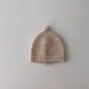 Gorro de lana cálido para bebé estilo coreano ins color liso otoño e invierno para niños y niñas simple versátil gorro para el frío