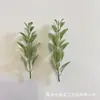 Plantas artificiais do fabricante, incluindo ramos de pinho de Natal simulados, folhas aveludadas, guirlandas de Natal e artesanatos de Natal para decoração, material PE para atacado e plantas preservadas