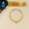 Loja de ouro com contas de transferência de cor esmalte de areia de ouro antigo cobre de duas cores feliz banhado a ouro moda pulseira olho de gato coringa atacado