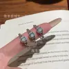 Venta al por mayor del fabricante Xiaohongshu Anillo de encaje de plata S925 con incrustaciones de jade azul natural Estilo de lujo ligero europeo y americano