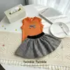 2026 Nuevo Estilo Conjunto de Verano para Niñas: Top Camiseta con Lazo + Falda a Cuadros Dulce y Elegante para Bebé
