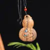 Venta Directa de Fábrica del Popular Colgante de Lujo Negro y Dorado del Dios de la Riqueza con un Buda sin Rostro, Adecuado para Colgar en el Cuello o en el Coche