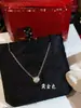 Versión alta tarjeta de collar OVNI familia un diamante femenino V chapado en oro oro de 18 quilates diamante único pequeño colgante redondo collar cadena de clavícula dropshipping