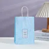 Bolsa de embalaje impresa bolsa de papel bolsa de regalo floral tienda mayorista bolsa de mano bolsa de compras