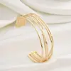 Pulsera Exagerada de Acero Inoxidable Prensado al Aceite de Venta Caliente Transfronteriza, Pulsera Irregular de Acero de Titanio con Recubrimiento Galvánico de Color Dorado Real de 18K que Conserva el Color, Lujo Ligero