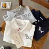Polo Infantil 2026 Ojos Bizcos Primavera Nuevo Producto Polo de Dibujos Animados Perrito para Niños y Niñas Camiseta de Bebé con Cuello