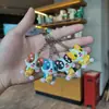 Llavero Creativo y Lindo de Cachorro Tomando Té de Leche Muñeco 3D de Goma Suave de PVC Colgante para Bolso Pequeño Regalo Promocional