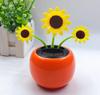 Ventas directas de fábrica adorno de flor de manzano solar para coche giratorio automático girasol accesorios de decoración para coche al por mayor