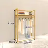 Perchero de exhibición dorado para tienda de ropa estante para tienda de ropa de mujer combinación de pared de piso a techo estante para tienda de ropa de niño perchero para toda la tienda