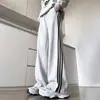 Nuevos pantalones casuales de alta gama para hombre en stock para venta al por mayor, versátiles de pierna recta, juveniles, de lujo, para exteriores, a rayas, deportivos