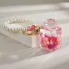 Garrafa de areia movediça de celebridade da internet criativa com contas coloridas em um pingente de garrafa de óleo acrílico chaveiro pingente bolsa pequenos acessórios atacado